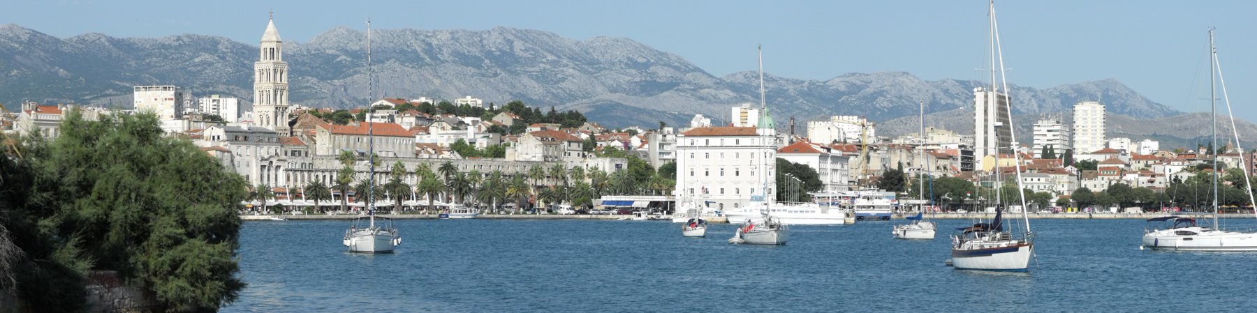 Split’s waterfront promenade with palm trees and historic buildings in Croatia
